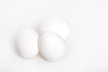 Three eggs on white background