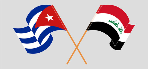 Crossed and waving flags of Cuba and Iraq