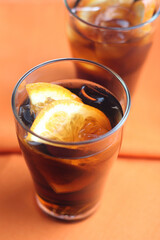 Cola with ice and lemon