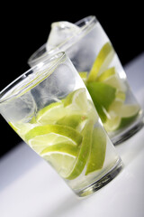 Studio shot of drinks with lime slices