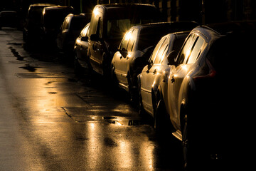 Car silhouettes during sunset in the capital