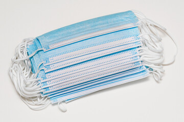 Medical masks isolated on white. Disposable surgical face mask protects against coronavirus, dust, dirt, flu and bacteria. Respiratory, mouth and nose protection. Medical equipment, healthcare