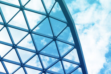 Metal glass roof structure of shopping center against the sky