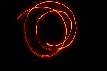 fiery whirlwind on a dark background on a long exposure