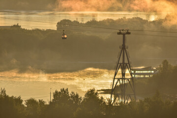 dawn over the cable car across the river