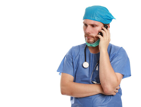 Concerned Doctor Speaking On The Phone Isolated On A White Background