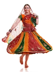 Fotobehang Beautiful young female Bollywood dancer in traditional vivid orange dress with veil © Fyle