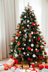 Christmas tree by the window interior of the room New Year holiday gifts