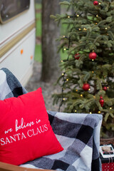Christmas pillow near Christmas tree