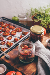 Preserving of Sun Dried Tomatoes with Herbs in a Jar
