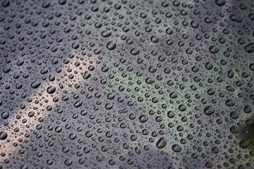 Rain drops on glass background. Raindrops on glass with reflection