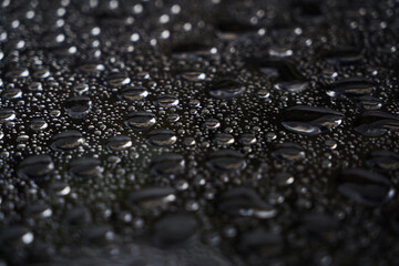 Rain drops on glass background. Raindrops on glass with reflection