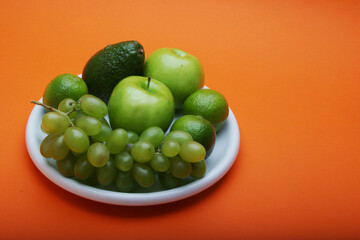 Exotic fruits on white plate
