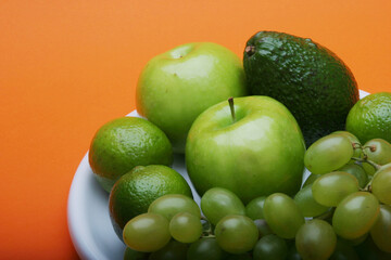 Exotic fruits on white plate
