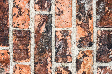 Simple red brick wall. Industrial grunge texture. Factory exterior wall backdrop. Old architecture pattern.
