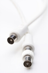 Audio and video cables on white background