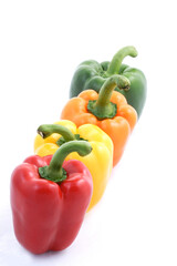 Four paprikas on white background