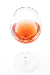 Glass of rose wine on white bacground