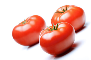Close-up of tomatoes on white background