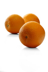 Oranges on white background - close-up