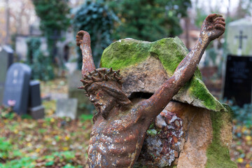 Historic Statue on the autumn mystery old Prague Cemetery, Czech Republic