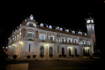 Fototapeta na wymiar The Clock building of the port of Valencia at night