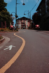 Fototapeta premium Gramado, RS, Brazil, October 18, 2020, Tourists walking along the famous Rua Torta decorated for the Christmas light festivities.