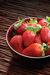 Strawbwrry on wooden background - close-up