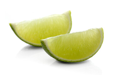 Limes on white background - close-up