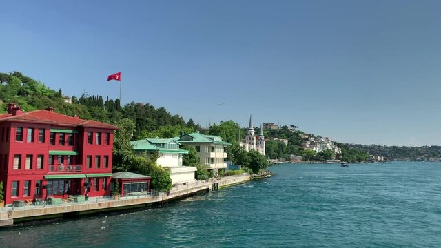 Footage of mansions and historical military school called "Kuleli Askeri Lisesi" at upscale neighborhood called "Kandilli" in Istanbul. It is a beautiful Bosphorus scene in a sunny summer day.