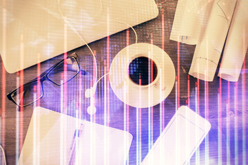 Multi exposure of forex graph drawing over desktop background with computer. Concept of financial analysis. Top view.