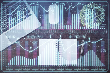 Stock market graph and top view computer on the table background. Double exposure. Concept of financial education.