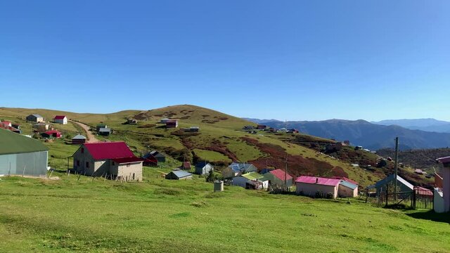 Footage of mountain village (high plateau) called "Sis Dagi" of Trabzon city of Black sea region in Turkey. Beautiful nature scene in sunny day. Camera moves forward.