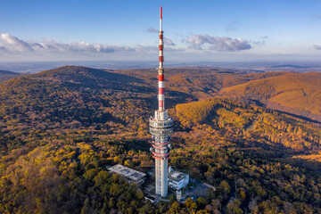 Fototapeta premium Hungary - TV tower in Pecs with Mecsek hills from drone view