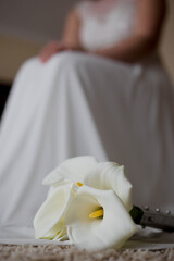 Vertical shot of a bride's white bog arum bouquet