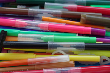 multiple colorful pens close up top view