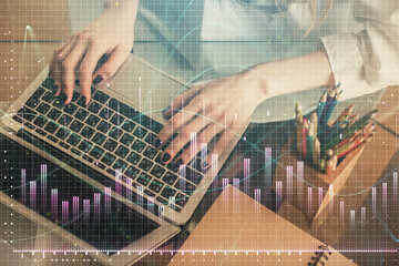 Double exposure of woman hands typing on computer and forex chart hologram drawing. Stock market invest concept.