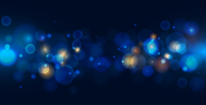 Abstract bokeh light on dark blue background. 