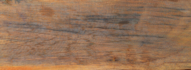 old brown wood texture has a crack.