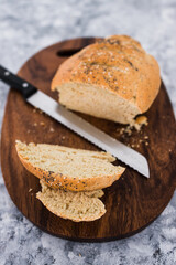 simple food ingredients, homemade australian damper bread without yeast freshly made and on top of cutting board