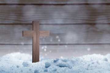 Christian cross on the snow