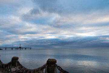 pier on the lake in a cold winter day