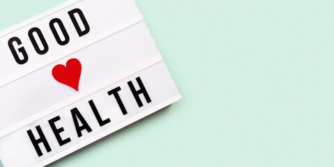 Healthcare and medical concept. Lightbox with words Good Health. Health wishes. Top view.