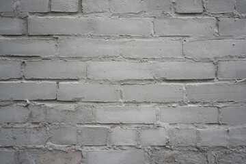 Light Grey Brick Wall Texture Background with Signs of Degradation