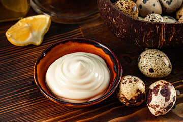  Homemade mayonnaise with quail eggs on the table