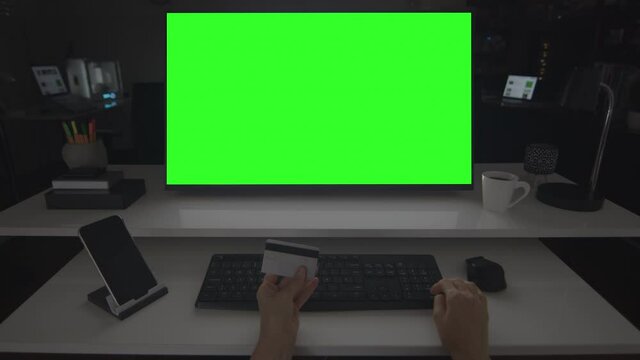 Online shopping. Hands typing information on a keyboard. Credit card. Desktop computer with chroma key. Perfect to put your own images or videos. Track corners with perspective corner pin.  