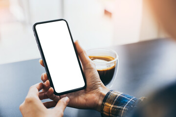 cell phone blank white screen mockup.woman hand holding texting using mobile on desk at office.background empty space for advertise.work people contact marketing business,technology