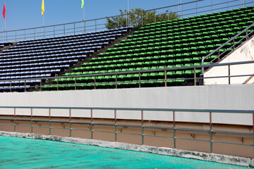 Empty stadium. Rows of yellow seats in stadium. Concept of empty stadium without spectators, quarantine time