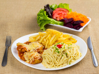 Typical Brazilian food, executive dish, food menu. Beef, Spaghetti, beans, potato and crumbs with accompaniments