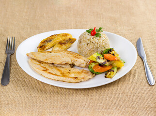 Typical Brazilian food, executive dish, food menu. Chicken breast, rice, beans, potato and crumbs with accompaniments